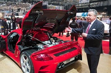 Alois Ruf explains that the money goes in HERE and the horsepower comes out HERE