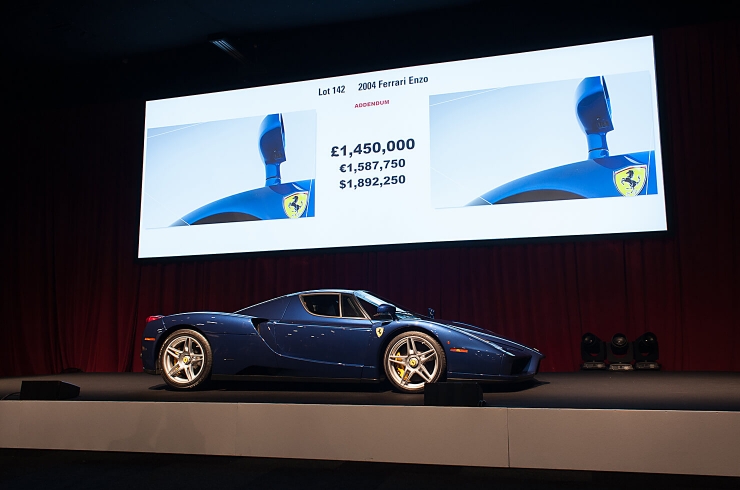 Say $2.3m Ferrari Enzo. Non-original colour might have affected price