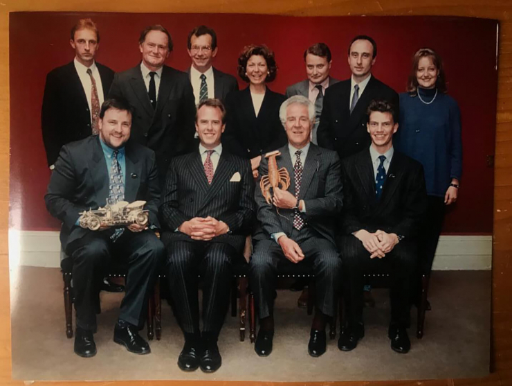 The author (top left) and other members of the Sotheby’s car department pose for the camera in 1997. Peter, front row, holds ‘Parsons’ the lobster whose fame extended across the globe, even appearing on peak-time UK TV (Private collection)