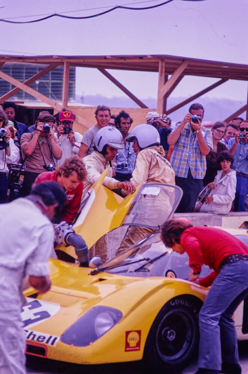 Lothar Motschenbacher confers with de Cad during a pitstop at the 1971 6 Hours of Watkins Glen. The yellow Ferrari 512 M had retired at Le Mans that year with transmission trouble but finished 4th overall at the ’Glen behind a works Alfa Romeo and the two Gulf-Porsche 917s (Bob Hines) 